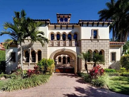 Spanish style mansion is located in Naples, FL. Courtyard en