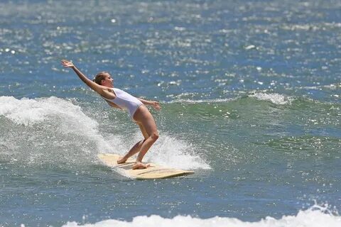 MARGOT ROBBIE in Swimsuit Surfing in Hawaii 07/19/2016 - Haw