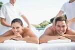 Smiling Couple Enjoying Couples Massage Poolside Photos - Fr