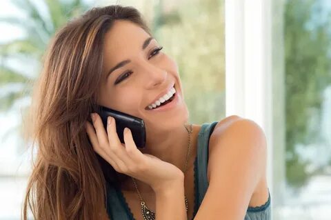 Young Woman Talking On Cell Phone - Health Coach Solutions
