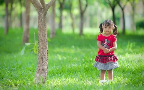 Girl in red and gray clothes standing near tree HD wallpaper