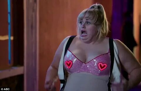 Rebel Wilson lets it all hang out as she strips down to her 