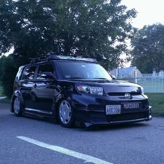 slammed black Scion xB with body kit thule rack out of Rhode