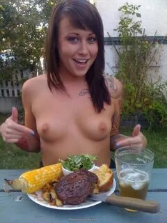 A girl with small tits and tattoos eating food outside :: EroticaSearch.net...