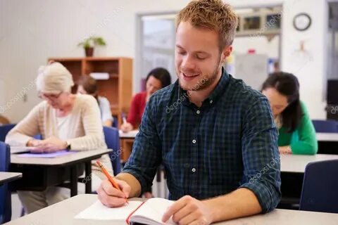 Man studying at an adult education class Stock Photo by © mo