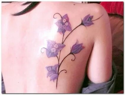 Pretty purple orchid back tattoo