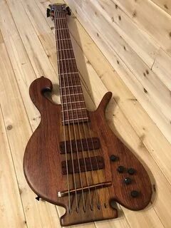 Carl Thompson 6 string lined fretless Whale Tail Bass guitar