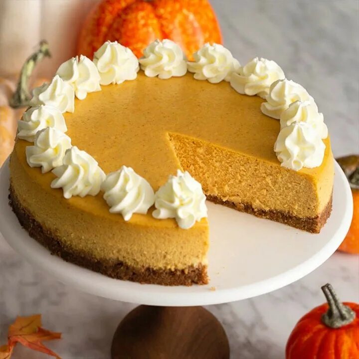 Pumpkin Cheesecake Recipe has a light and creamy filling with all your favo...