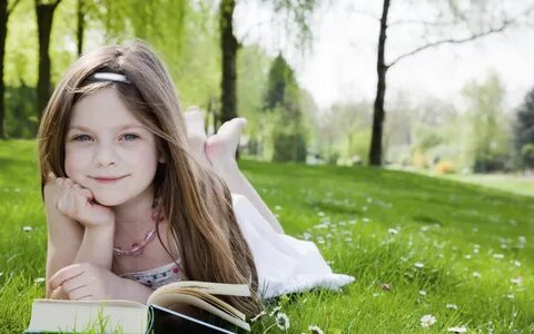 Cute Little Girl Reading Book In Garden Wallpaper for 2560x1