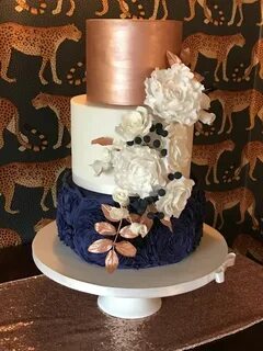 Rose gold and navy blue wedding cake, coordinating sugar flo