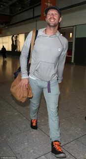 Chris Martin sports form-fitting trousers at London's Heathr