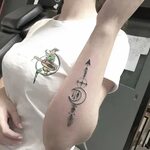 Stylized arrow and crescent moon tattoo - Tattoogrid.net