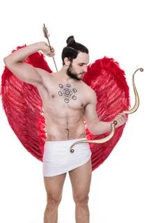 Handsome Young Guy Dressed Like Cupid with Bow and Arrows. V