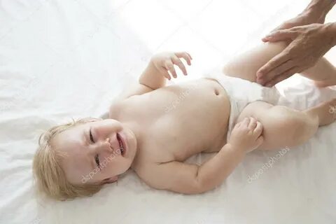 Baby crying on white bed Stock Photo by © quintanilla 758722