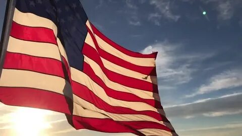 american flag flying wind sunrise slow Stok Videosu (%100 Te