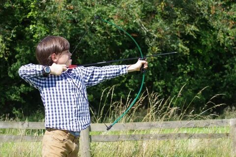 Boy shoots a bow free image download