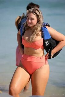 iskra lawrence spotted in an orange bikini during a beach ph