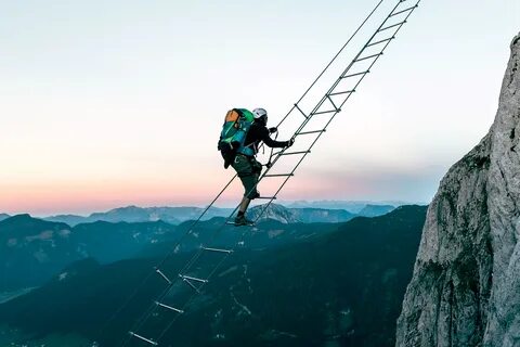 Huge ladder strung between two mountains looks like the real