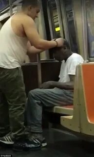 New York subway passenger gives his shirt to a homeless man 