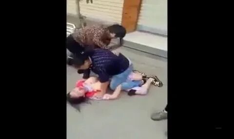 Chinese mistress stripped naked and beaten by an angry wives