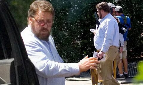 Russel Crowe, 55, looks worlds away from his typically chise