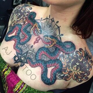 Epic female snake chest piece tattoo by Aaron Ashworth at WA