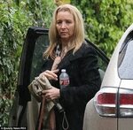 Lisa Kudrow looks glum as she goes make-up free in LA downpo