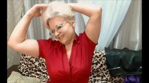 Cute Russian granny flexes her big arms on cam