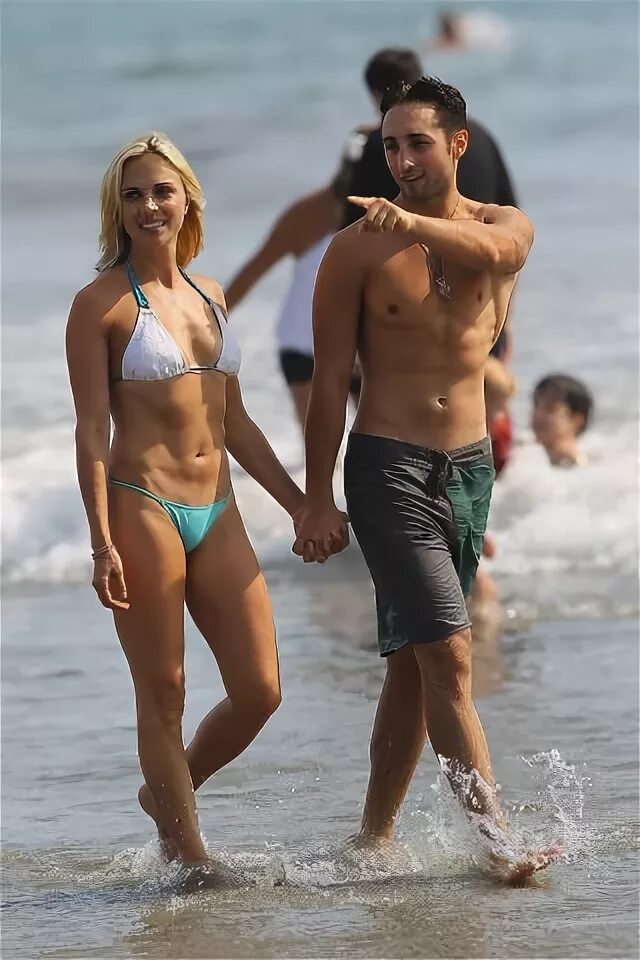 A Bikini clad Kelly Sullivan spotted on the beach with her s
