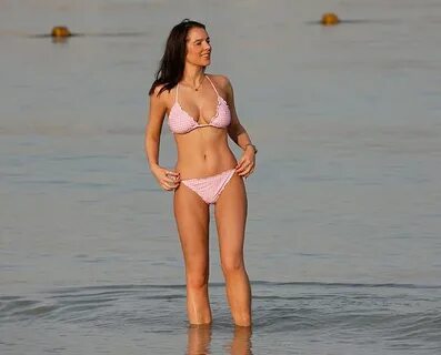 Helen Flanagan slips into a gingham string bikini as she soa