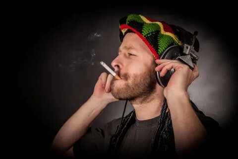 Wallpaper Rasta man in headphones with a cigarette " On-desk