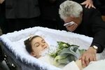 Andreea Brazovan in her open casket during her funeral. Dead