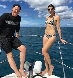 Heather Dubrow flaunts toned abs in snakeskin bikini while i