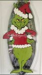 How cute is this Grinch door hanger? Hes the perfect additio