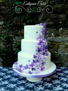 White wedding cake with purple butterflies by Euthymia Cakes