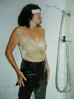 Mistress wears latex in the shower - Fetish Porn Pic