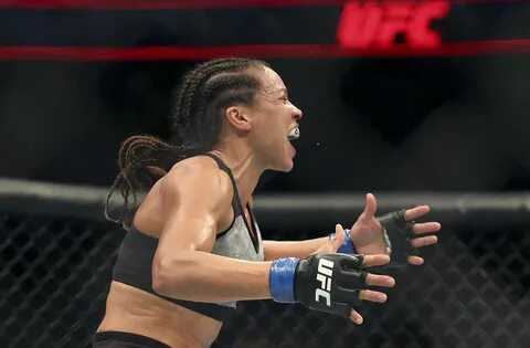 Marion Reneua celebrates after her win against Sara McMann d