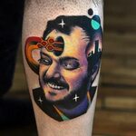 Psychedelic Stanley Kubrick tattoo on the right calf.