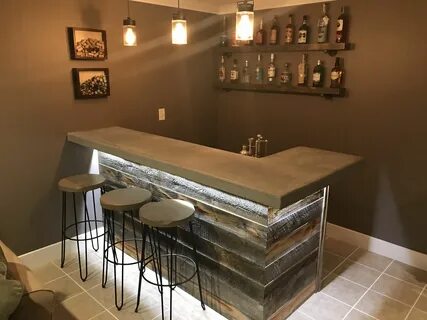 Concrete bar top with reclaim wood bar. Rustic man cave vibe