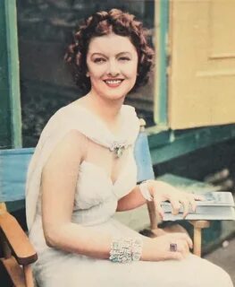 Books and Art: Myrna Loy, interrupted while reading, uses he