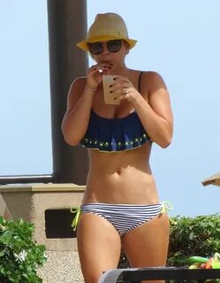 Kaley Cuoco - wearing a bikini at a pool in Mexico GotCeleb