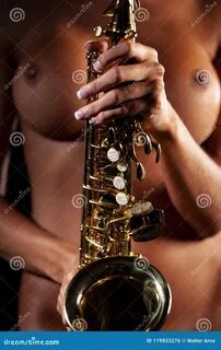 Nude Model Playing A Saxophone In A Studio Environment Stock Photo 