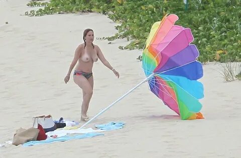 Marilyn Milian topless on a beach