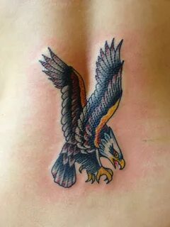 style bald eagle tattoo on lower back: Traditional Tattoos B