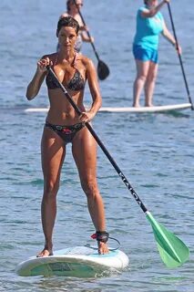 Nicole Murphy In a bikini paddleboarding at the beach -01 Go