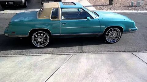 85 cutlass on 22" rims with flowmasters - YouTube