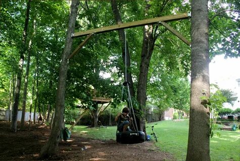 tire swing between two trees -- great idea if you don't have