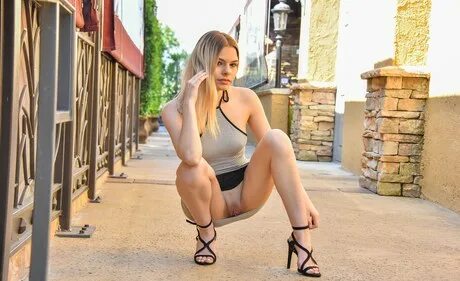 Hot dirty blonde teen with bare legs is a public exhibitioni