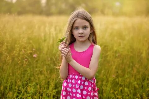 Wallpaper Little long-haired girl in a pink sarafan on the f