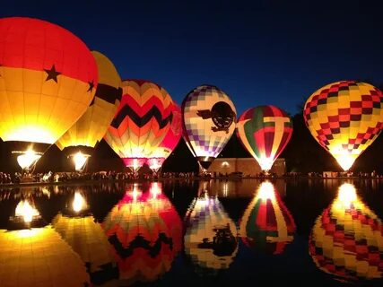 Hot air balloons illuminated on a lake in Cincinnati for Bal